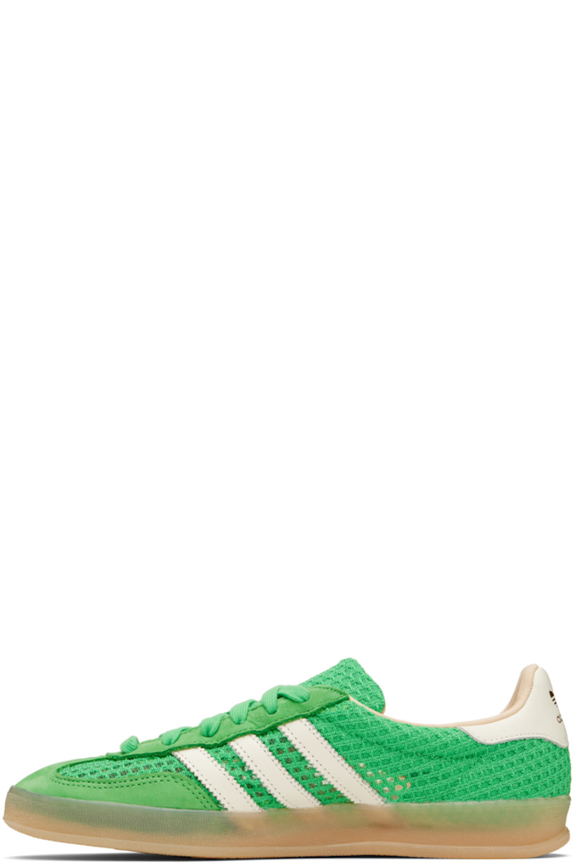Low-top mesh, grained faux-leather, and faux-suede sneakers in green.

· Lace-up closure
· Padded collar
· Signature serrated stripes at sides
· Logo printed at heel tab
· Grained leather lining
· Logo embossed at textured rubber midsole
· Treaded rubber sole

Supplier color: Energy green/Off white/Magic beige