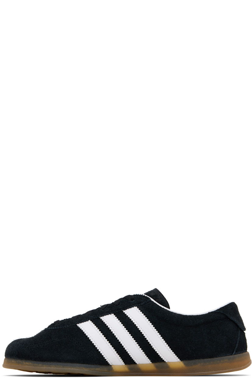 Low-top faux-suede sneakers.

· Lace-up closure
· Logo printed at tongue
· Padded collar
· Signature serrated stripes at sides
· Text stamp at outer side
· Grained faux-leather lining
· Treaded rubber sole

Supplier color: Black/White/Gum