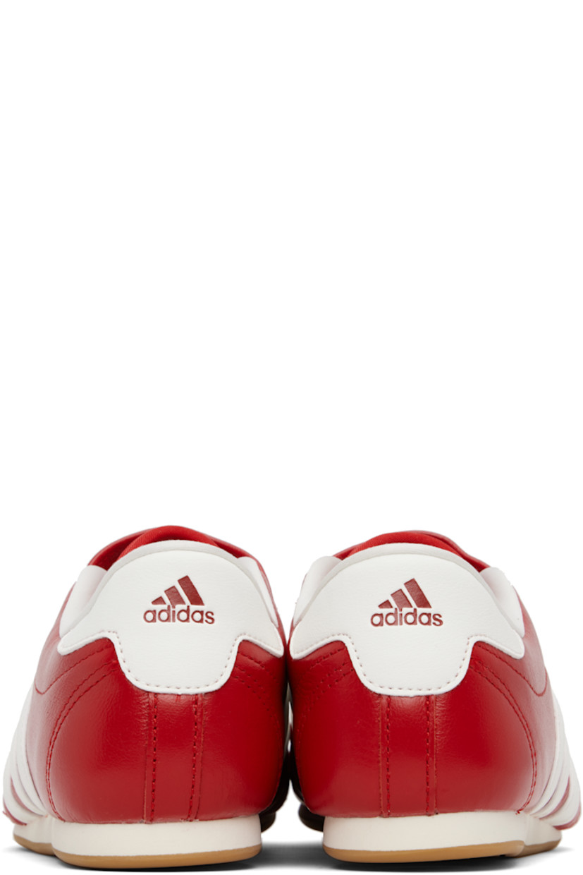 Low-top buffed leather sneakers.

· Quilted detailing at toe
· Logo embossed at vamp and heel tab
· Concealed elasticized gusset
· Padded tongue and collar
· Signature stripes and perforations at sides
· Buffed leather and mesh lining
· Treaded rubber sole

Supplier color: Red/Off white/Gum