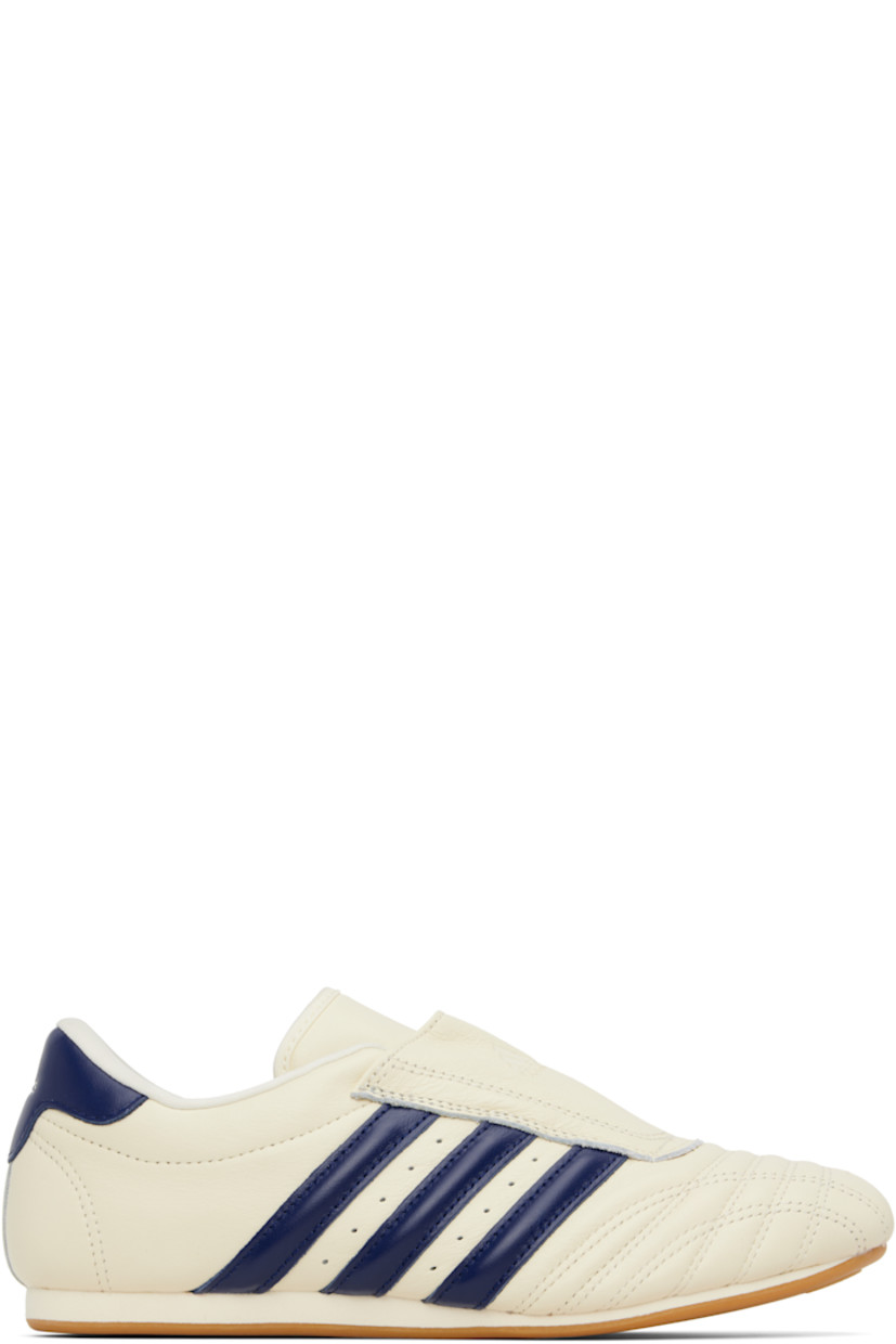 Low-top buffed leather sneakers.

· Quilted detailing at toe
· Logo embossed at vamp and heel tab
· Concealed elasticized gusset
· Padded tongue and collar
· Signature stripes and perforations at sides
· Buffed leather and mesh lining
· Treaded rubber sole

Supplier color: Cream white/Victory blue/Gum