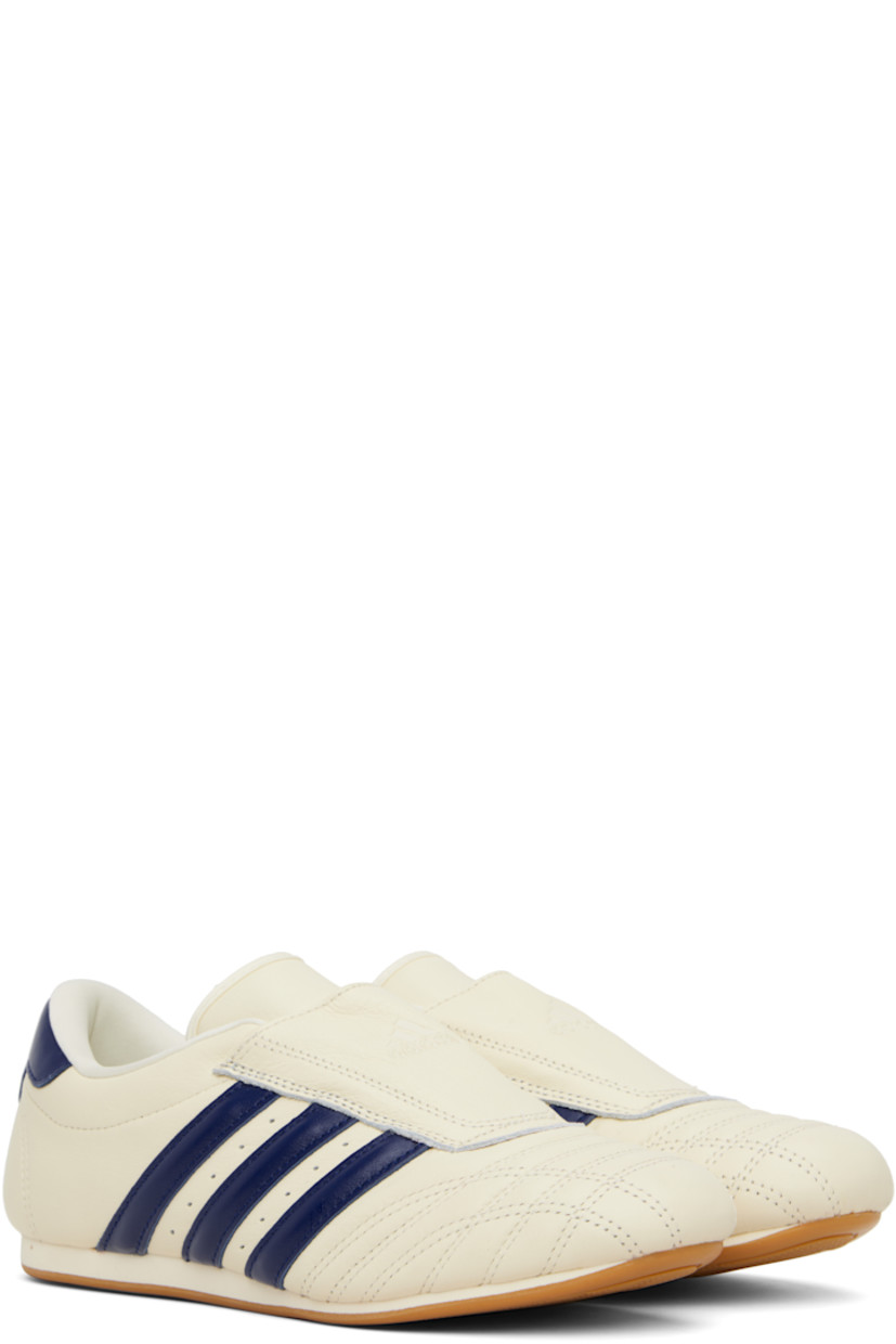 Low-top buffed leather sneakers.

· Quilted detailing at toe
· Logo embossed at vamp and heel tab
· Concealed elasticized gusset
· Padded tongue and collar
· Signature stripes and perforations at sides
· Buffed leather and mesh lining
· Treaded rubber sole

Supplier color: Cream white/Victory blue/Gum