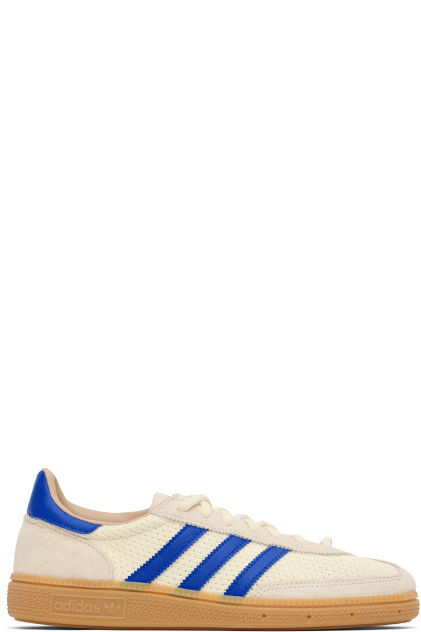 Low-top paneled mesh, suede, and buffed faux-leather sneakers.

· Lace-up closure
· Logo patch at tongue
· Padded collar
· Signature serrated stripes at sides
· Perforations at midsole 
· Treaded rubber sole 

Supplier color: Cream white/Blue/Warm sandstone