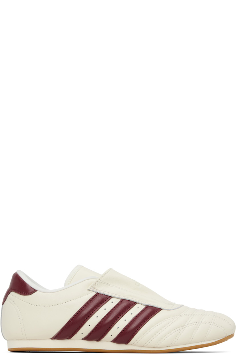 Low-top buffed leather sneakers.

· Quilted detailing at toe
· Logo embossed at vamp and heel tab
· Concealed elasticized gusset
· Padded tongue and collar
· Signature stripes and perforations at sides
· Buffed leather and mesh lining
· Treaded rubber sole

Supplier color: Off white/Noble maroon
