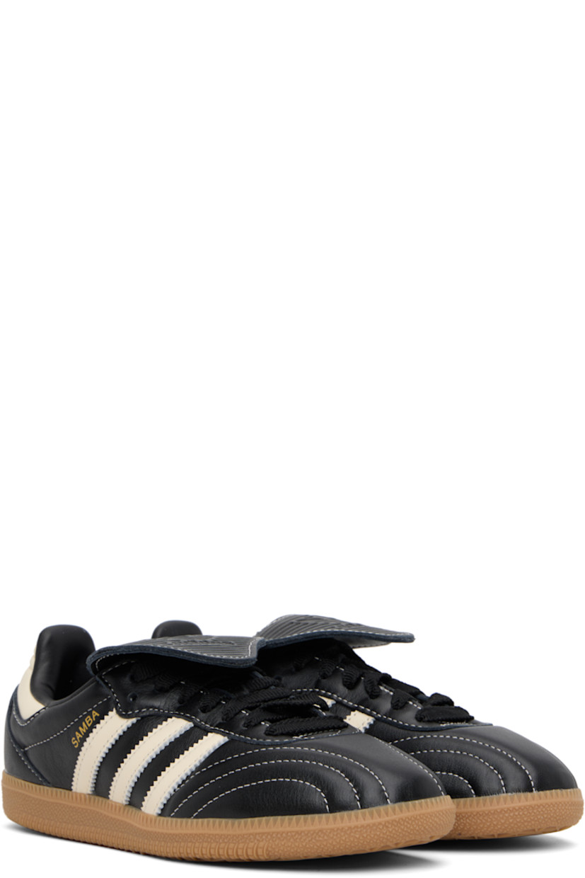 Low-top quilted buffed leather sneakers.

· Lace-up closure
· Logo embossed at extended tongue
· Padded collar
· Signature serrated stripes at sides
· Text stamp at outer side
· Grained faux-leather lining
· Treaded rubber sole
· Contrast stitching in white

Supplier color: Core black/Cream white/Gum