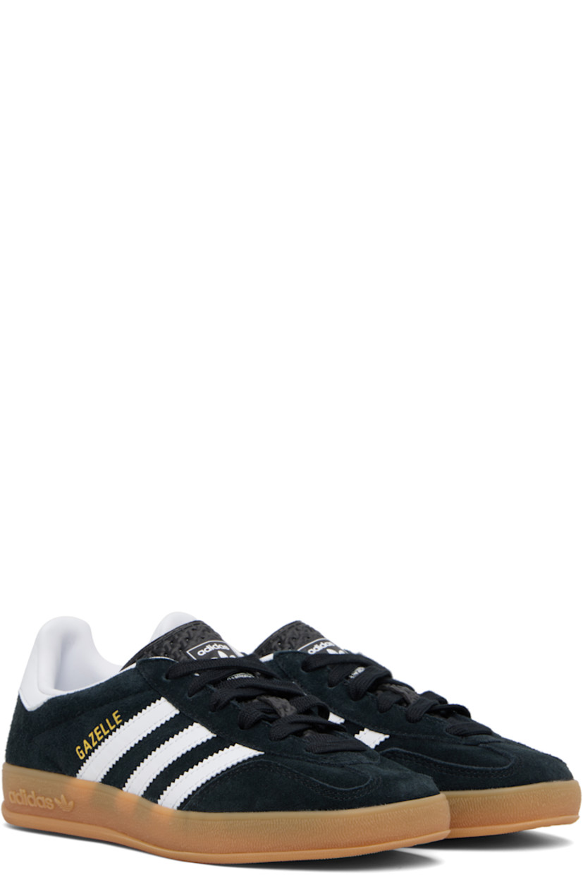 Low-top suede and buffed leather sneakers.

· Lace-up closure
· Logo printed at tongue
· Padded collar
· Text stamp at outer side
· Signature serrated stripes at sides
· Buffed leather lining
· Treaded rubber sole

Supplier color: Core black/Future white/Gum