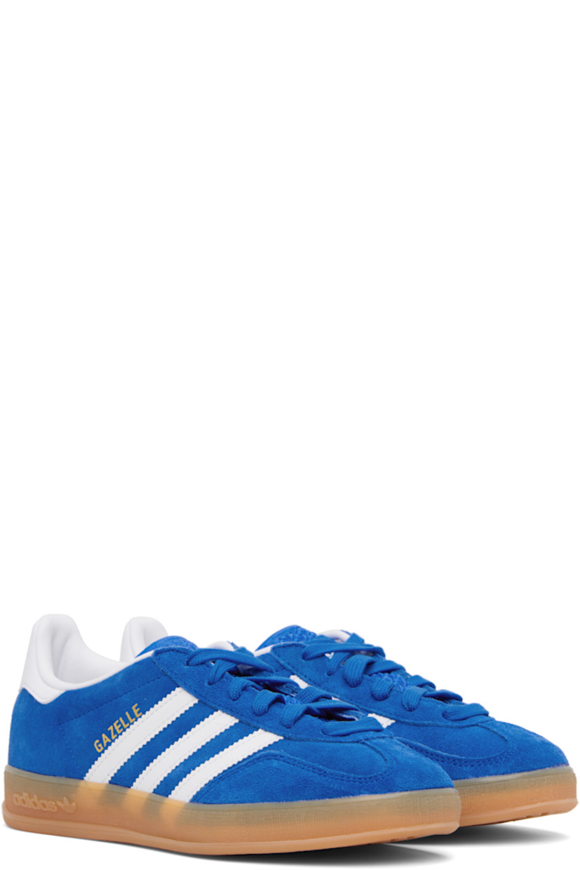 Low-top suede and buffed leather sneakers.

· Lace-up closure
· Logo printed at tongue
· Padded collar
· Text stamp at outer side
· Signature serrated stripes at sides
· Buffed leather lining
· Treaded rubber sole

Supplier color: Bluebird/Future white/Gum