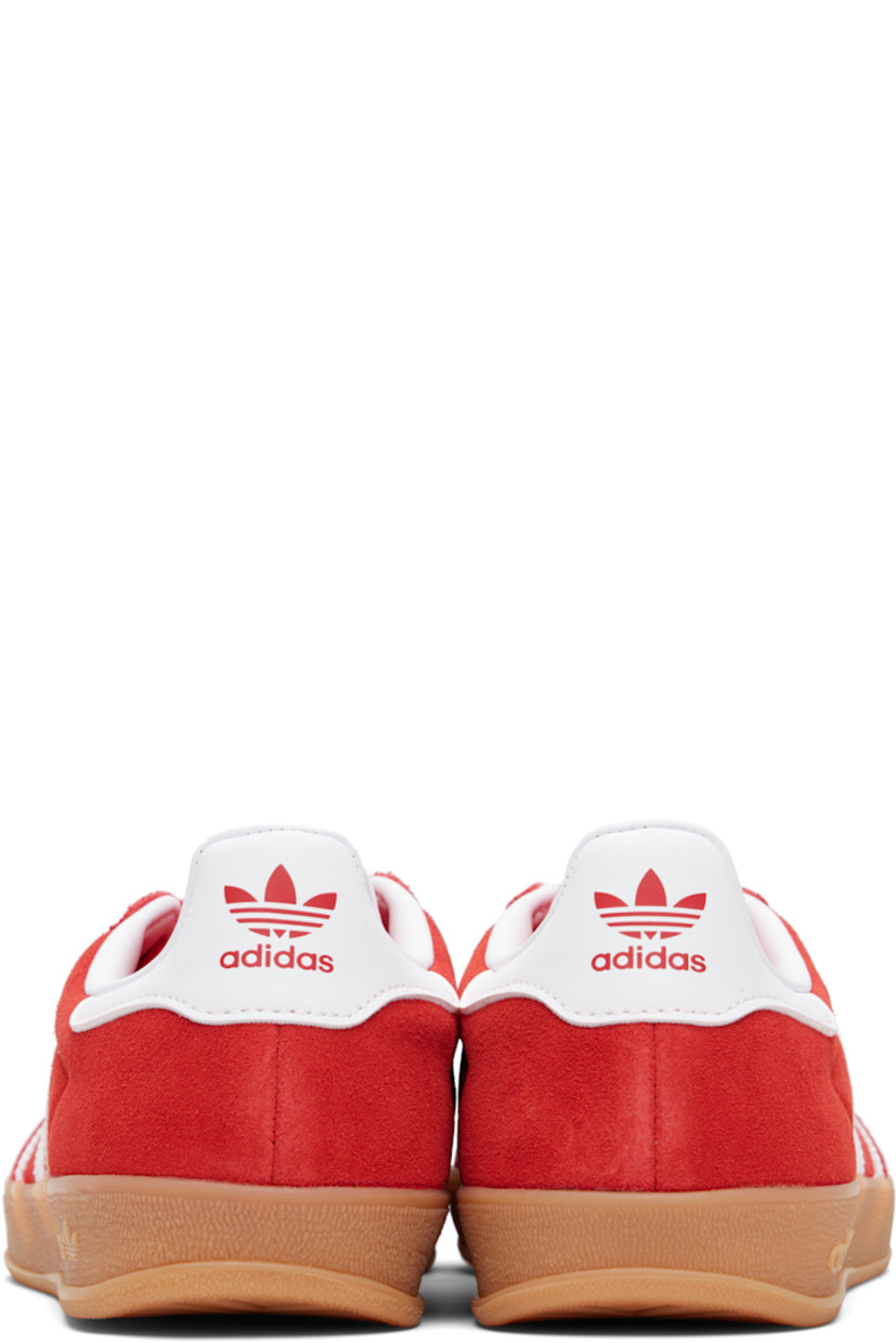 Low-top suede sneakers.

· Lace-up closure
· Logo printed at textured tongue
· Padded collar
· Text stamp at outer side
· Signature serrated stripes at sides
· Logo printed at heel tab
· Jersey lining
· Treaded rubber sole
· Includes alternate laces

Supplier color: Better scarlet/Cloud white/Gum