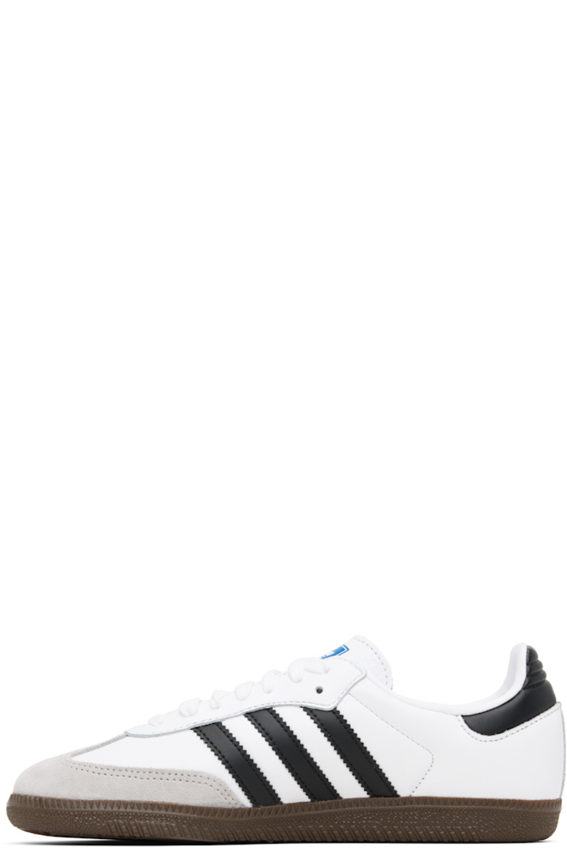Low-top buffed leather sneakers.

· Nubuck trim at toe
· Lace-up closure
· Logo printed at tongue
· Padded collar
· Signature serrated stripes at sides
· Logo printed at outer side
· Faux-leather and jersey lining
· Treaded rubber sole

Supplier color: Cloud white/Core black/Clear granite