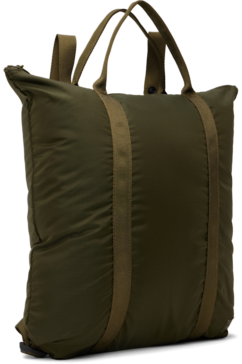 Coated nylon ripstop tote in khaki.

· Packs into zip compartment at interior
· Lightweight
· Converts to backpack
· Fixed carry handles
· Adjustable shoulder straps
· Logo patch at face
· Zip closure
· Zip pocket at interior
· H16.5" x W15" x D1"

Part of the Flex collection.

Supplier color: Olive drab