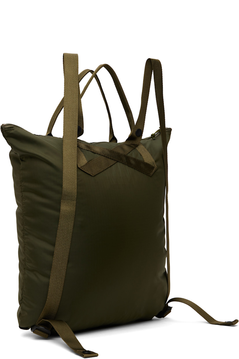 Coated nylon ripstop tote in khaki.

· Packs into zip compartment at interior
· Lightweight
· Converts to backpack
· Fixed carry handles
· Adjustable shoulder straps
· Logo patch at face
· Zip closure
· Zip pocket at interior
· H16.5" x W15" x D1"

Part of the Flex collection.

Supplier color: Olive drab