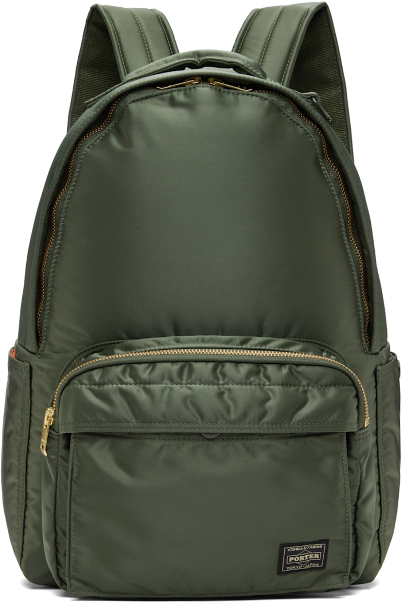 Nylon twill backpack in khaki.

· Padded carry handle
· Adjustable padded shoulder straps
· Bellows pocket at zip compartment
· Logo patch at face
· Patch pocket at sides
· Padded back face
· Two-way zip closure
· Patch pocket at interior
· Taffeta lining
· Logo-engraved gold-tone hardware
· H15" x W11.5" x D5.25" / 12 L

Supplier color: Sage green