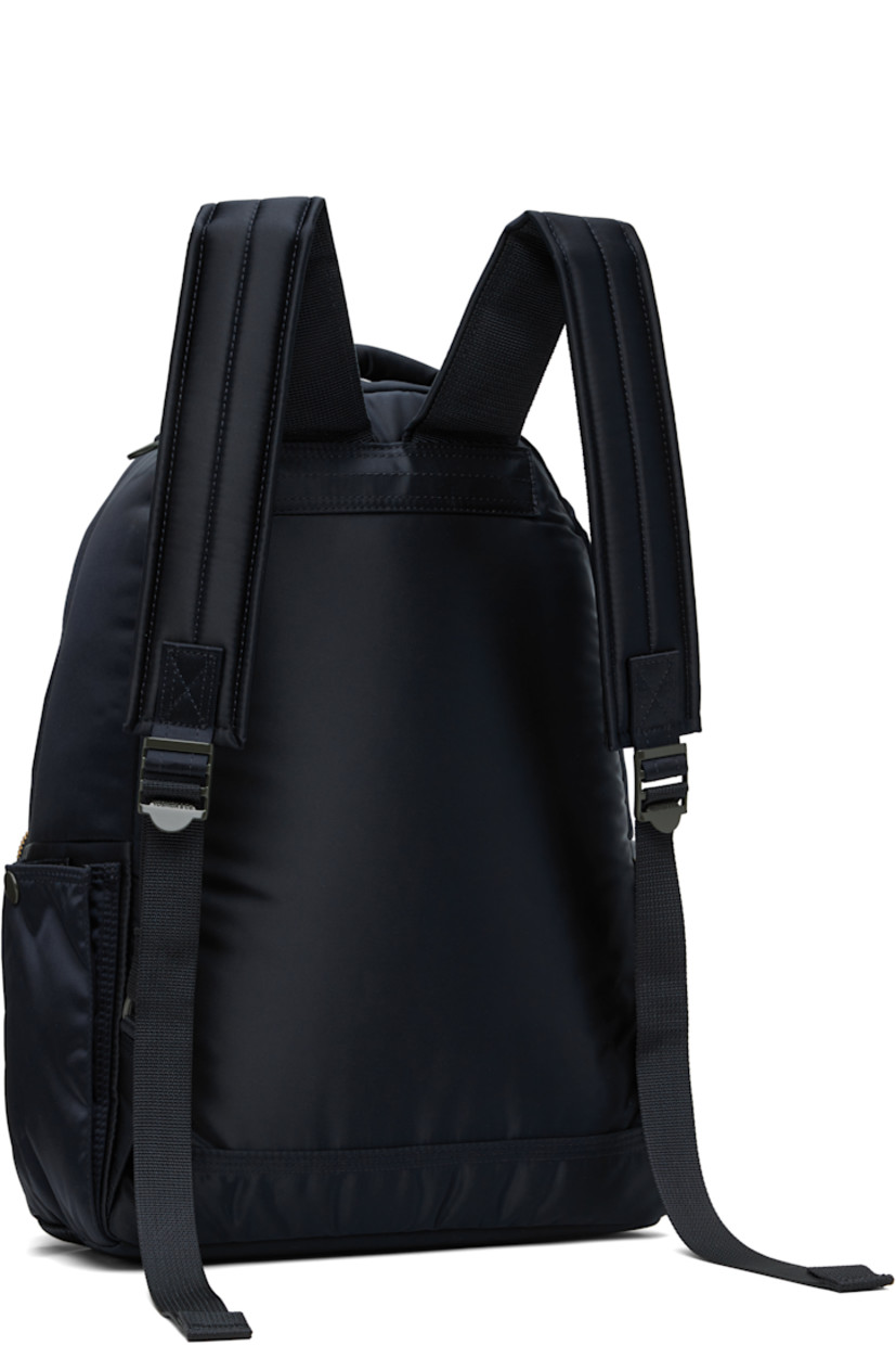 Nylon twill backpack in navy.

· Padded carry handle
· Adjustable padded shoulder straps
· Bellows pocket at zip compartment
· Logo patch at face
· Patch pocket at sides
· Padded back face
· Two-way zip closure
· Patch pocket at interior
· Taffeta lining
· Logo-engraved gold-tone hardware
· H15" x W11.5" x D5.25" / 12 L

Supplier color: Iron blue