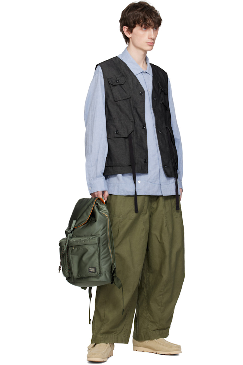 Nylon twill backpack in khaki.

· Padded carry handle
· Adjustable padded shoulder straps
· Zip compartments and logo patch at face
· Zip closure at padded back face
· Flap with press-stud fastening
· Cord-lock drawstring closure
· Patch pocket at interior
· Taffeta lining
· Logo-engraved gold-tone hardware
· H17" x W13" x D5" / 14 L

Supplier color: Sage green