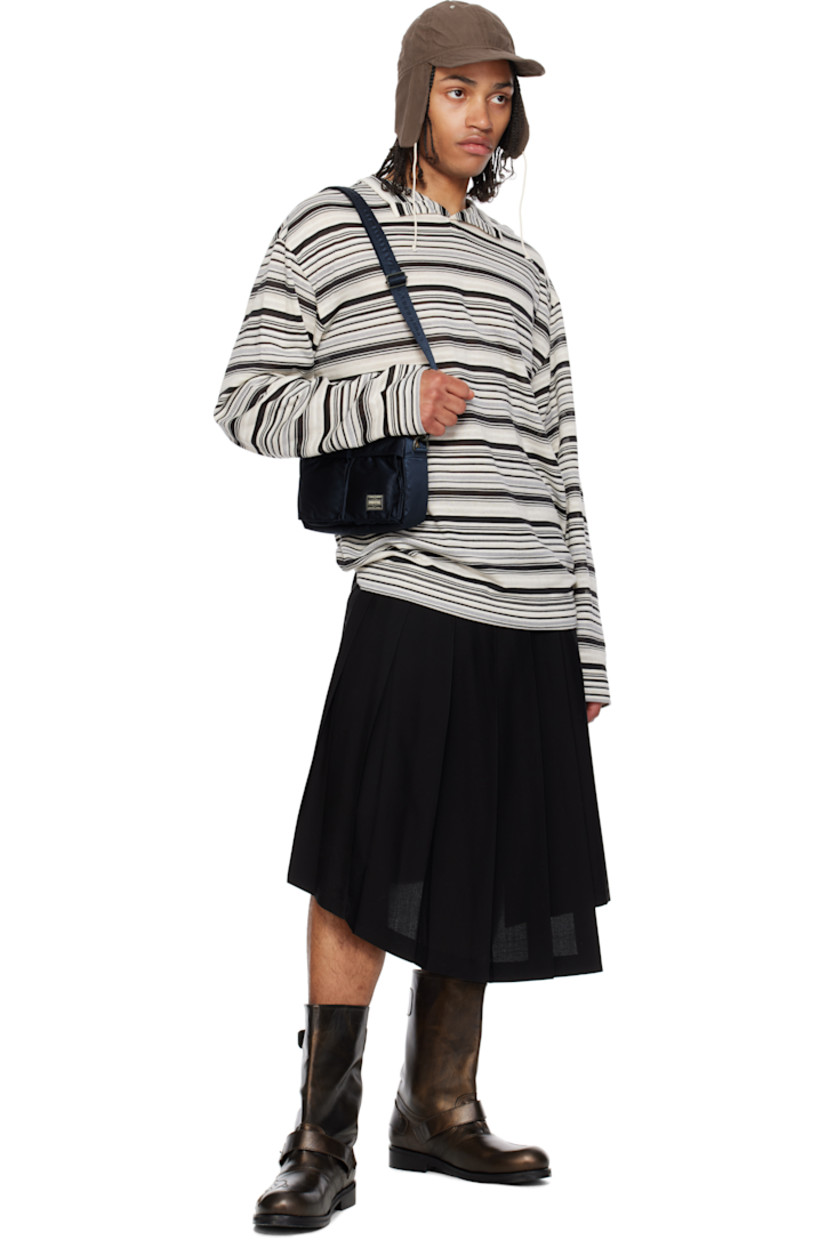 Nylon twill messenger bag in navy.

· Adjustable and detachable crossbody strap
· Bellows pockets and logo patch at face
· Patch pocket at back face
· Zip closure
· Patch pocket at interior
· Taffeta lining
· Logo-engraved gold-tone hardware
· H6" x W9" x D1.75"

Supplier color: Iron blue