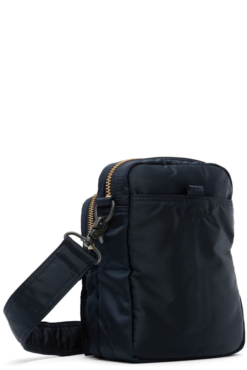Nylon twill messenger bag in navy.

· Adjustable and detachable crossbody strap
· Logo patch at face
· Bellows and zip pocket
· Patch pocket at back face
· Zip closure
· Patch pocket at interior
· Taffeta lining
· Logo-engraved gold-tone hardware
· H8" x W6" x D3"

Supplier color: Iron blue