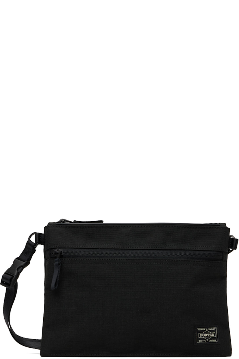 X-C1000 nylon canvas pouch in black.

· Lightweight and waterproof
· Adjustable and detachable crossbody strap
· Logo patch at face
· Zip pocket
· Zip closure
· Patch pockets at interior
· 1000 denier CORDURA® canvas lining 
· H7.5" x W10" x D1"

Part of the Hybrid collection.

Supplier color: Black