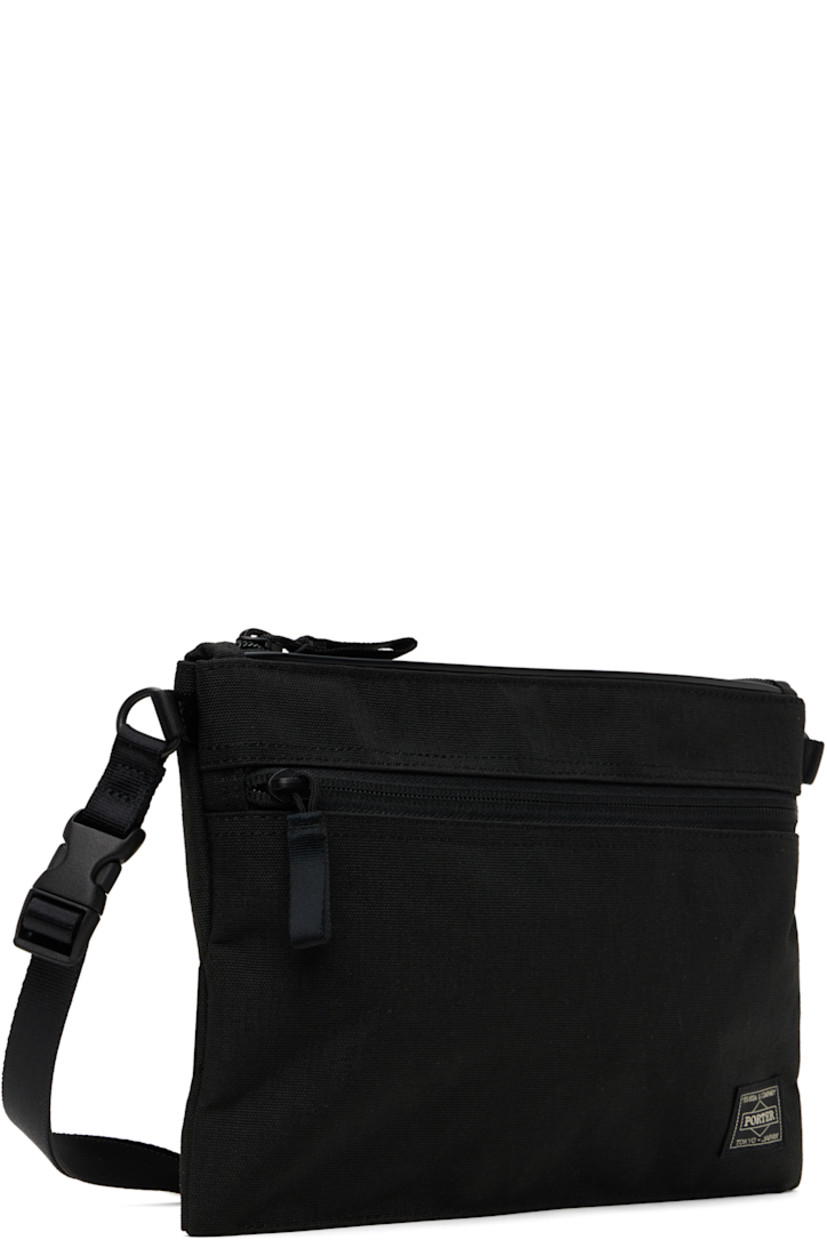 X-C1000 nylon canvas pouch in black.

· Lightweight and waterproof
· Adjustable and detachable crossbody strap
· Logo patch at face
· Zip pocket
· Zip closure
· Patch pockets at interior
· 1000 denier CORDURA® canvas lining 
· H7.5" x W10" x D1"

Part of the Hybrid collection.

Supplier color: Black