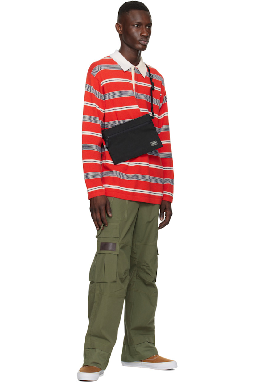 X-C1000 nylon canvas pouch in black.

· Lightweight and waterproof
· Adjustable and detachable crossbody strap
· Logo patch at face
· Zip pocket
· Zip closure
· Patch pockets at interior
· 1000 denier CORDURA® canvas lining 
· H7.5" x W10" x D1"

Part of the Hybrid collection.

Supplier color: Black