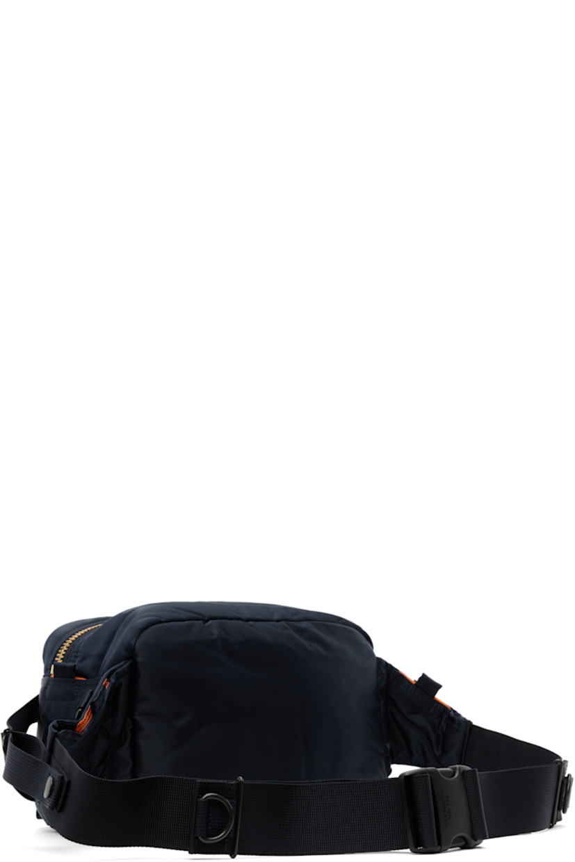 Nylon twill belt bag in navy.

· Adjustable webbing belt-style crossbody strap
· D-rings and patch pockets at strap
· Bellows pockets and logo patch at face
· Patch pocket and cinch strap at sides
· Zip closure
· Patch pocket at interior
· Taffeta lining
· Logo-engraved gold-tone hardware
· H6.5" x W10.5" x D5"

Supplier color: Iron blue