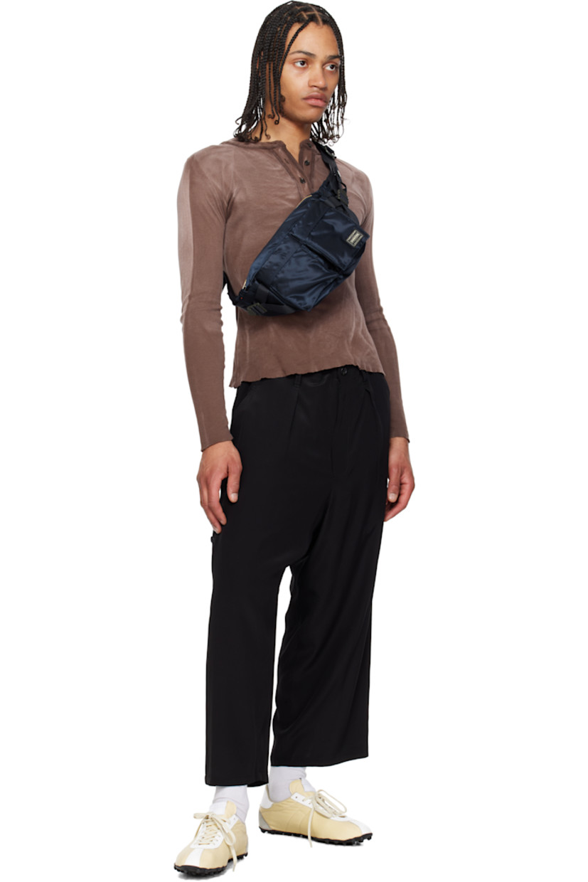 Nylon twill belt bag in navy.

· Adjustable webbing belt-style crossbody strap
· D-rings and patch pockets at strap
· Bellows pockets and logo patch at face
· Patch pocket and cinch strap at sides
· Zip closure
· Patch pocket at interior
· Taffeta lining
· Logo-engraved gold-tone hardware
· H6.5" x W10.5" x D5"

Supplier color: Iron blue