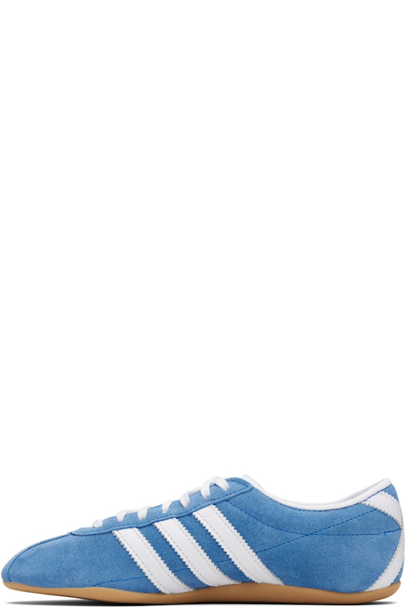 Low-top suede sneakers.

· Lace-up closure
· Logo embossed at tongue
· Padded collar
· Signature serrated stripes at sides and heel
· Logo stamp at outer side
· Leather lining
· Textured rubber sole

Supplier color: Blue bird/Cloud white/Gum