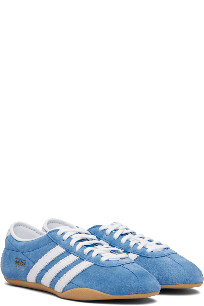 Low-top suede sneakers.

· Lace-up closure
· Logo embossed at tongue
· Padded collar
· Signature serrated stripes at sides and heel
· Logo stamp at outer side
· Leather lining
· Textured rubber sole

Supplier color: Blue bird/Cloud white/Gum