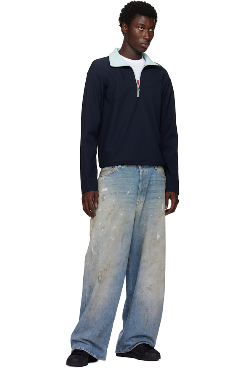 Low-top buffed leather sneakers.

· Textured rubber cap toe
· Lace-up closure
· Logo embossed at tongue and heel tab
· Padded tongue and collar
· Text printed at outer side
· Perforations and signature serrated stripes at sides
· Terrycloth lining
· Treaded rubber sole

Supplier color: Core black/Core black/Core black