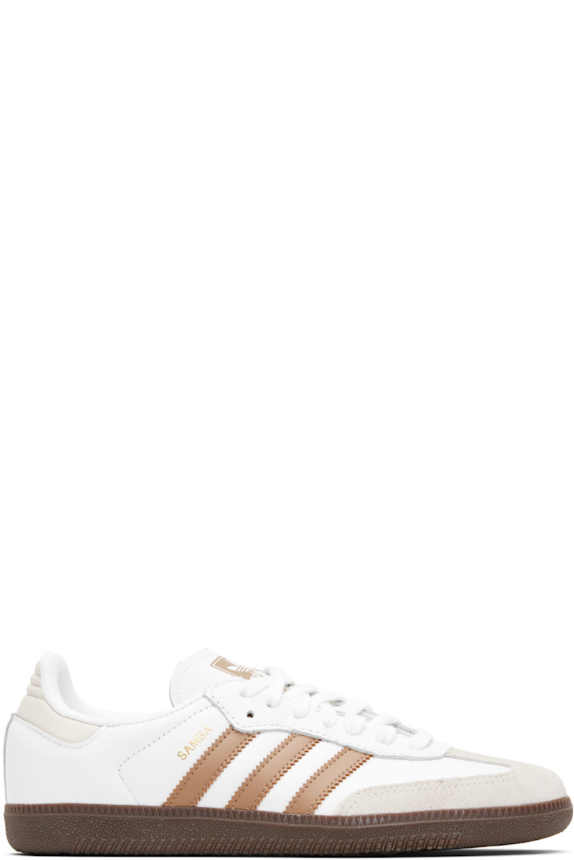Low-top buffed leather sneakers.

· Suede trim at toe
· Lace-up closure
· Logo printed at tongue
· Padded collar
· Text stamp at outer side
· Signature serrated stripes at sides
· Quilted heel tab
· Mesh lining
· Treaded rubber sole

Supplier color: Cloud white/Cardboard/Gum