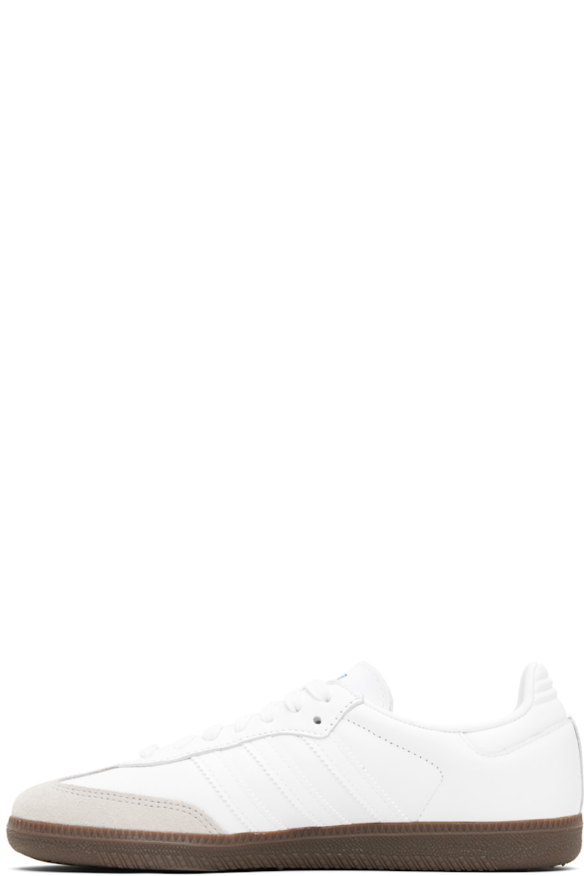 Low-top buffed leather sneakers.

· Suede trim at toe
· Lace-up closure
· Logo printed at tongue
· Padded collar
· Text stamp at outer side
· Signature serrated stripes at sides
· Quilted heel tab
· Mesh lining
· Treaded rubber sole

Supplier color: Cloud white/Cloud white/Gum