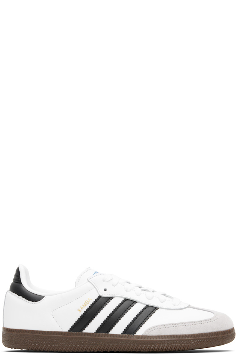 Low-top buffed leather sneakers.

· Suede trim at toe
· Lace-up closure
· Logo printed at tongue
· Padded collar
· Text stamp at outer side
· Signature serrated stripes at sides
· Quilted heel tab
· Mesh lining
· Treaded rubber sole

Supplier color: Cloud white/Core black/Clear granite