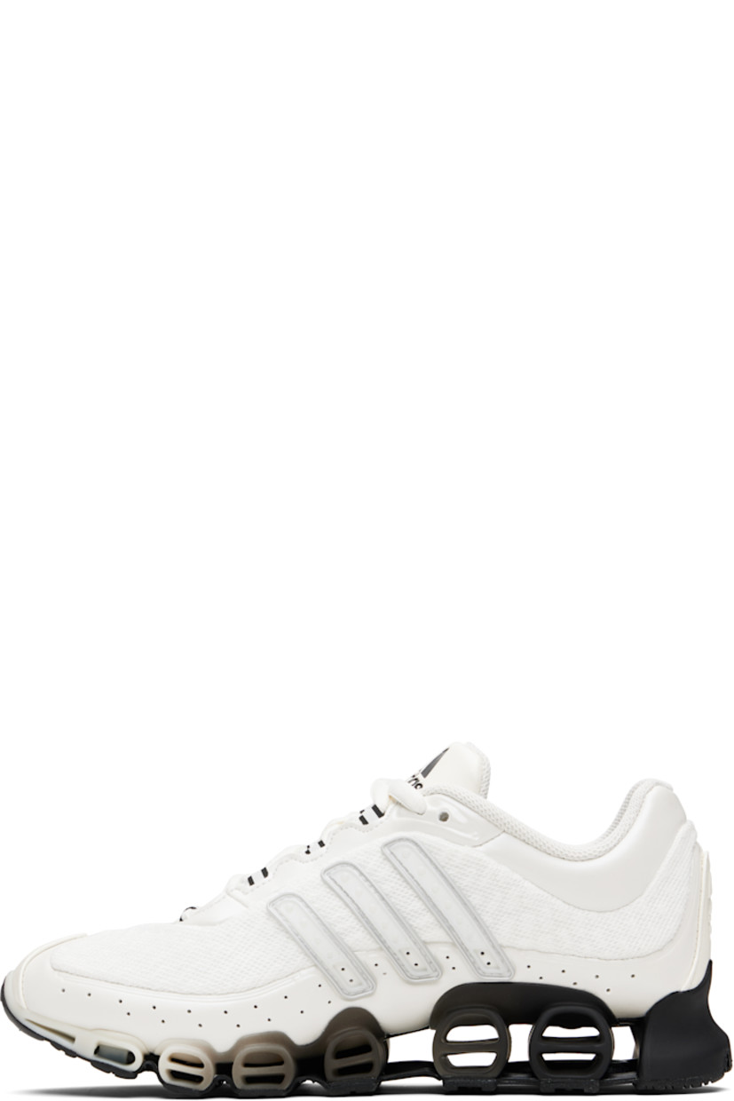 Low-top mesh and polished faux-leather sneakers.

· Textured rubber trim at toe and heel
· Lace-up closure
· Logo embossed at tongue
· Padded tongue and collar
· Rubber signature stripe appliqués at sides
· Logo embossed at heel tab
· Treaded rubber sole

Supplier color: Zero metallic/Matte silver/Black