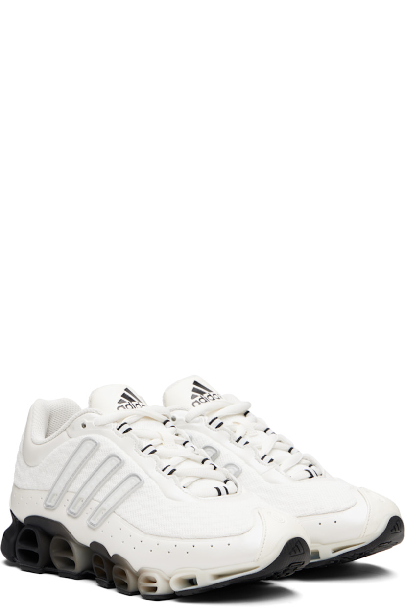 Low-top mesh and polished faux-leather sneakers.

· Textured rubber trim at toe and heel
· Lace-up closure
· Logo embossed at tongue
· Padded tongue and collar
· Rubber signature stripe appliqués at sides
· Logo embossed at heel tab
· Treaded rubber sole

Supplier color: Zero metallic/Matte silver/Black
