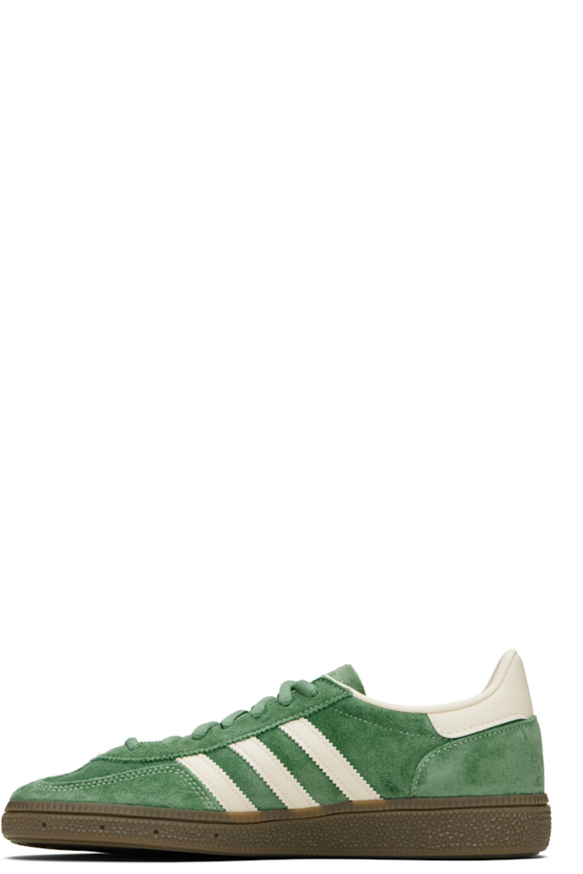 Low-top faux-suede and buffed faux-leather sneakers.

· Lace-up closure
· Logo patch at tongue
· Padded tongue and collar
· Signature serrated stripes at sides
· Text and logo stamp at outer side
· Treaded rubber sole

Supplier color: Preloved green/Cream white/Crystal white