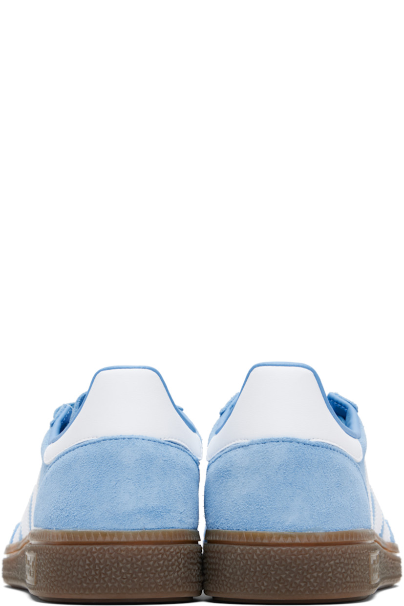 Low-top suede sneakers.

· Lace-up closure
· Logo patch at tongue
· Padded collar
· Text and logo stamp at outer side
· Signature serrated stripes at sides
· Mesh lining
· Treaded rubber sole

Supplier color: Light blue/Cloud white/Gum