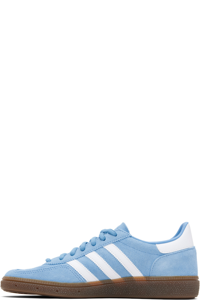 Low-top suede sneakers.

· Lace-up closure
· Logo patch at tongue
· Padded collar
· Text and logo stamp at outer side
· Signature serrated stripes at sides
· Mesh lining
· Treaded rubber sole

Supplier color: Light blue/Cloud white/Gum