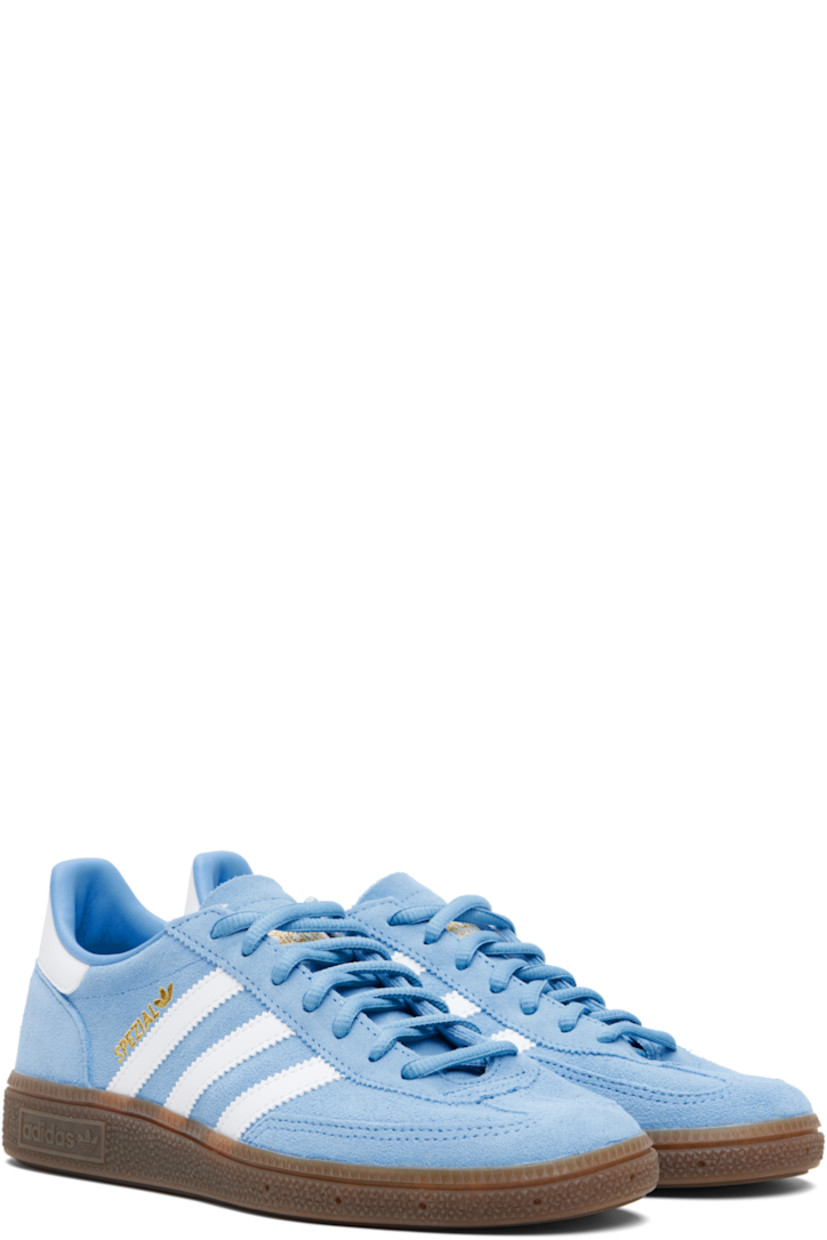 Low-top suede sneakers.

· Lace-up closure
· Logo patch at tongue
· Padded collar
· Text and logo stamp at outer side
· Signature serrated stripes at sides
· Mesh lining
· Treaded rubber sole

Supplier color: Light blue/Cloud white/Gum