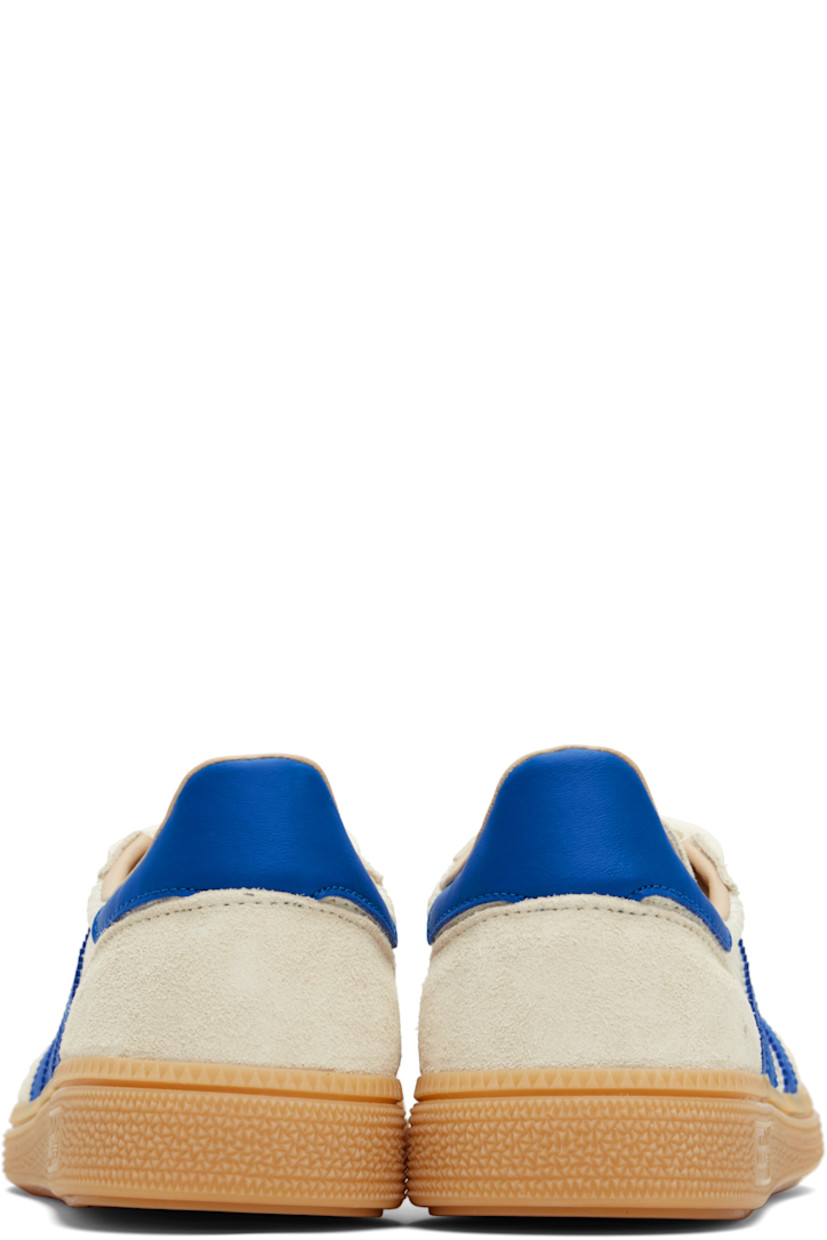 Low-top mesh and suede sneakers.

· Lace-up closure
· Logo patch at tongue
· Padded collar
· Signature serrated stripes at sides
· Mesh lining
· Treaded rubber sole

Supplier color: Cream white/Blue/Warm sandstone