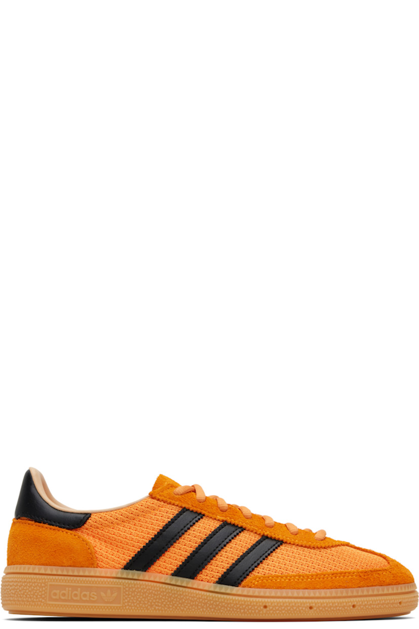 Low-top mesh and suede sneakers.

· Lace-up closure
· Logo patch at tongue
· Padded collar
· Signature serrated stripes at sides
· Mesh lining
· Treaded rubber sole

Supplier color: Crew orange/Core black/Warm sandstone