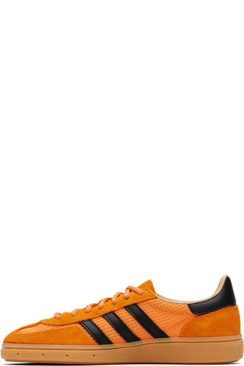 Low-top mesh and suede sneakers.

· Lace-up closure
· Logo patch at tongue
· Padded collar
· Signature serrated stripes at sides
· Mesh lining
· Treaded rubber sole

Supplier color: Crew orange/Core black/Warm sandstone