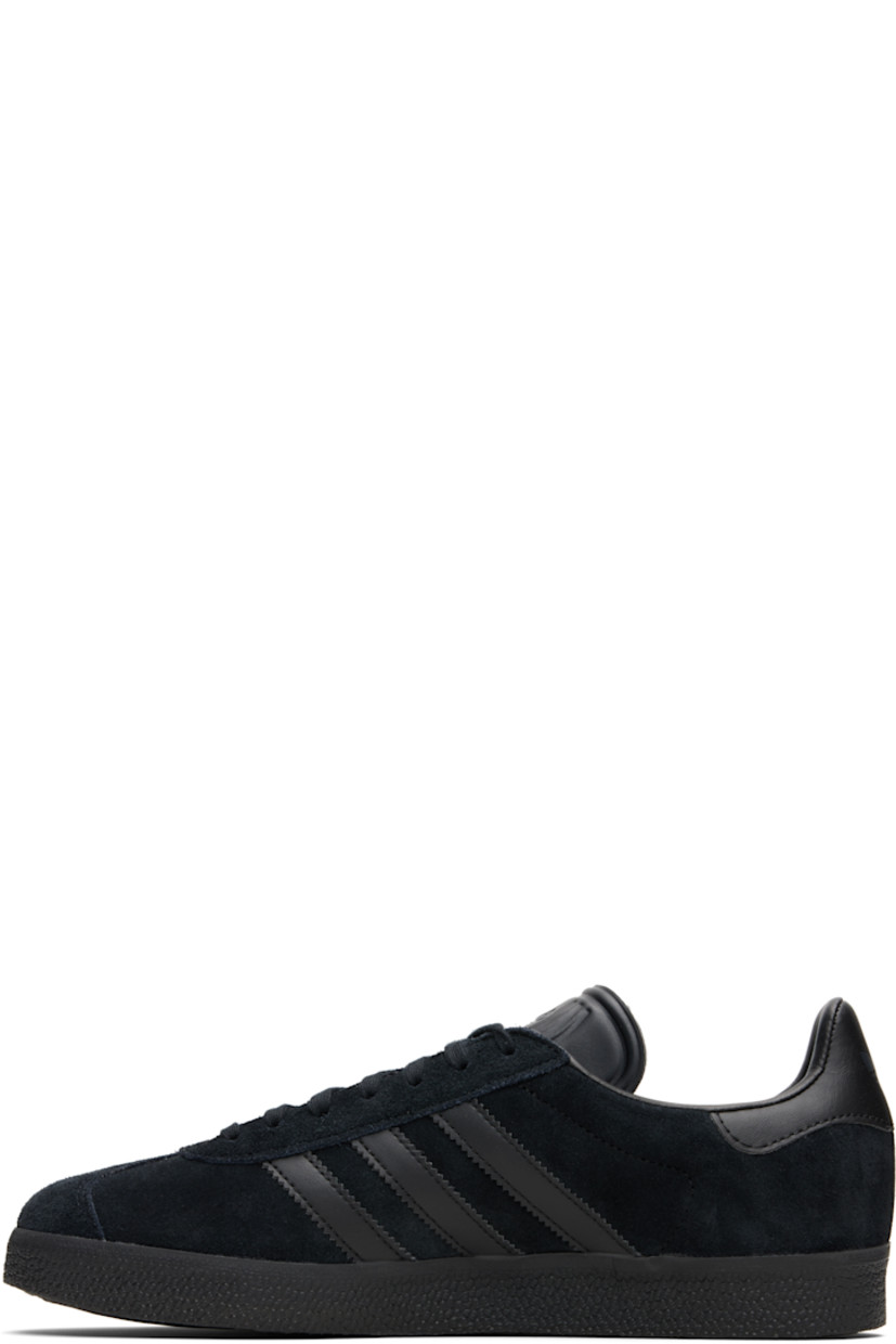 Low-top nubuck sneakers.

· Lace-up closure
· Logo embossed at tongue
· Padded collar
· Text printed at outer side
· Signature serrated stripes at sides
· Logo printed at heel tab
· Mesh lining
· Treaded rubber sole

Supplier color: Core black/Core black/Core black