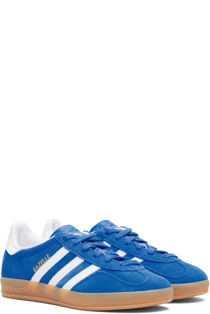 Low-top suede sneakers.

· Lace-up closure
· Logo printed at textured tongue
· Padded collar
· Text stamp at outer side
· Signature serrated stripes at sides
· Logo printed at heel tab
· Jersey lining
· Treaded rubber sole
· Includes alternate laces

Supplier color: Blue bird/Cloud white/Gum