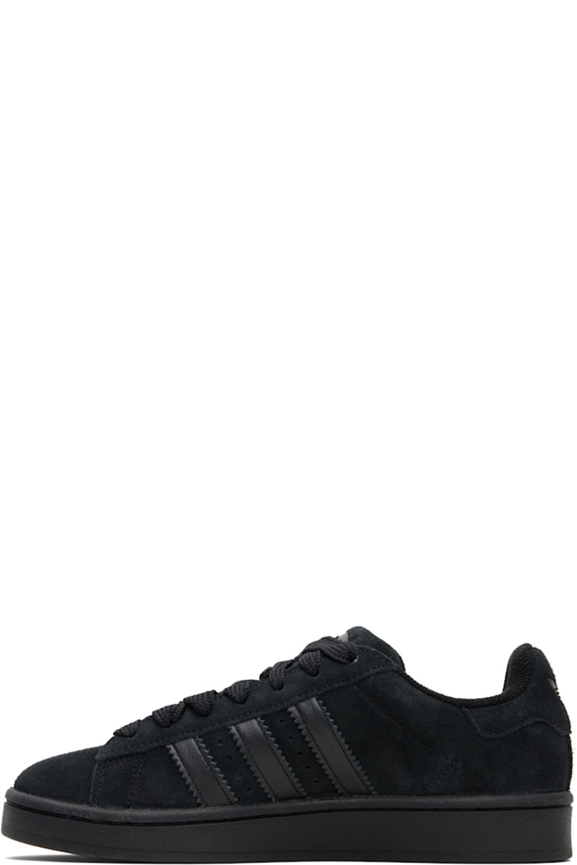Low-top suede sneakers.

· Lace-up closure
· Padded tongue and collar
· Logo printed at tongue and heel tab
· Text printed at outer side
· Perforations and signature serrated stripes at sides
· Terrycloth and mesh lining
· Treaded rubber sole

Supplier color: Core black/Core black/Core black