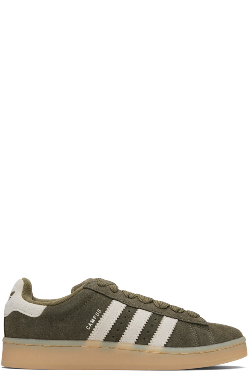 Low-top suede sneakers.

· Lace-up closure
· Logo embossed at tongue
· Padded tongue and collar
· Perforations at sides
· Signature serrated stripes
· Text stamp at outer side
· Logo embossed at heel tab
· Terrycloth lining
· Treaded rubber sole

Supplier color: Medium dark khaki/Off white/Gum