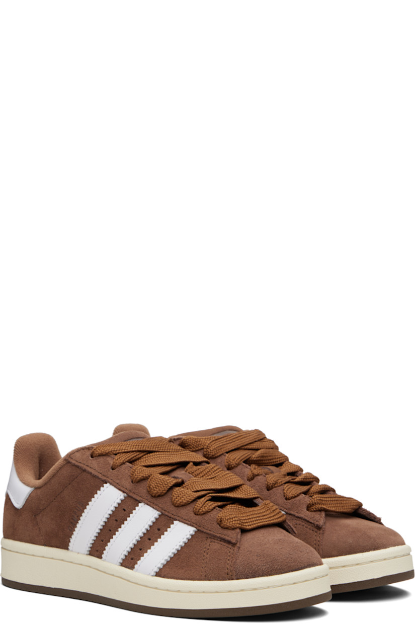 Low-top suede and buffed leather sneakers.

· Lace-up closure
· Logo embossed at tongue
· Padded tongue and collar
· Perforations at sides
· Signature serrated stripes
· Text stamp at outer side
· Logo embossed at heel tab
�· Terrycloth lining
· Treaded rubber sole

Supplier color: Bark/Cloud white/Off white