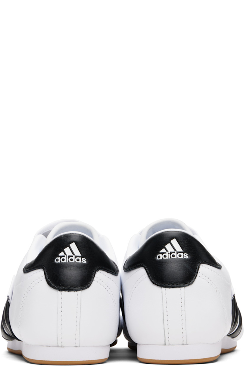 Low-top grained leather slip-on sneakers.

· Quilting at toe
· Logo embossed at vamp
· Concealed elasticized gusset
· Padded collar
· Perforations and signature stripes at sides
· Text flag at outer side
· Logo embossed at heel tab
· Leather and mesh lining
· Treaded rubber sole

Supplier color: Cloud white/Core black/Gum