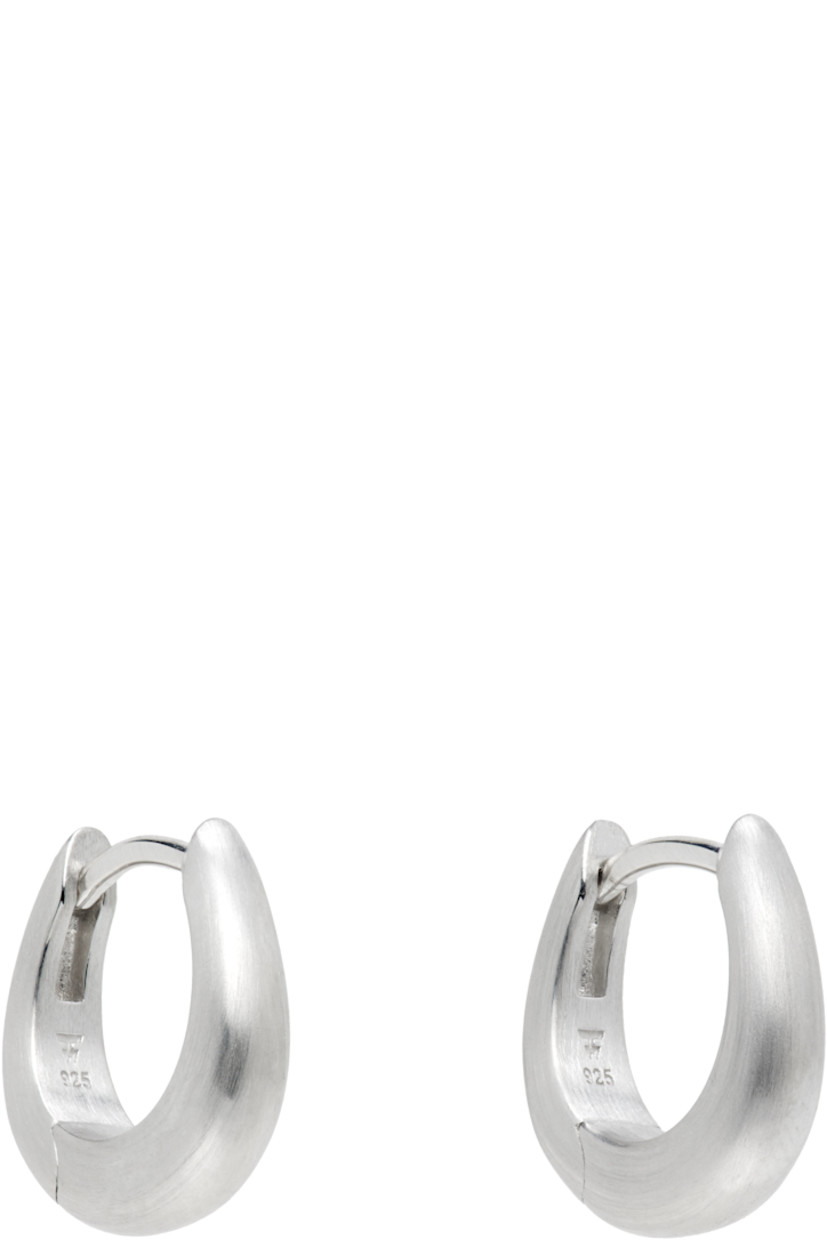 Pair of hoop earrings in rhodium-plated recycled sterling silver. 

· Hinged-post fastening
· D0.5"

Supplier color: 925 sterling