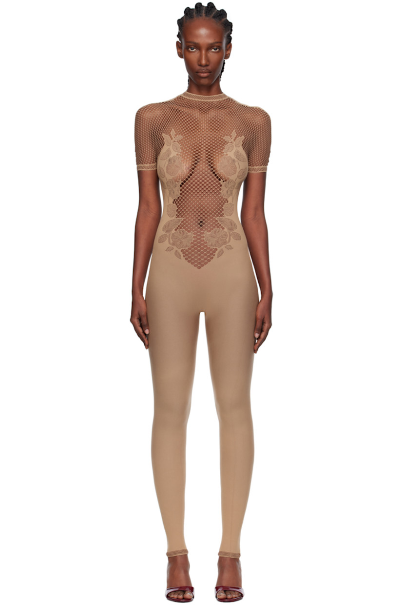 Stretch fishnet jumpsuit. 

· Semi-sheer
· Pointelle-knit floral pattern throughout
· Mock neck
· Button closure with crystal at back collar
· Jacquard logo at back

Supplier color: Beige