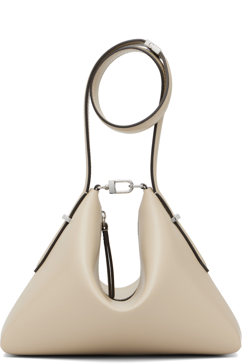 Buffed leather clutch. 

· Detachable shoulder strap
· Logo stamp at face
· Lobster clasp at top
· Zip closure
· Microsuede lining
· Silver-tone hardware
· H7” x W9.5” x D3”

Supplier color: Fawn