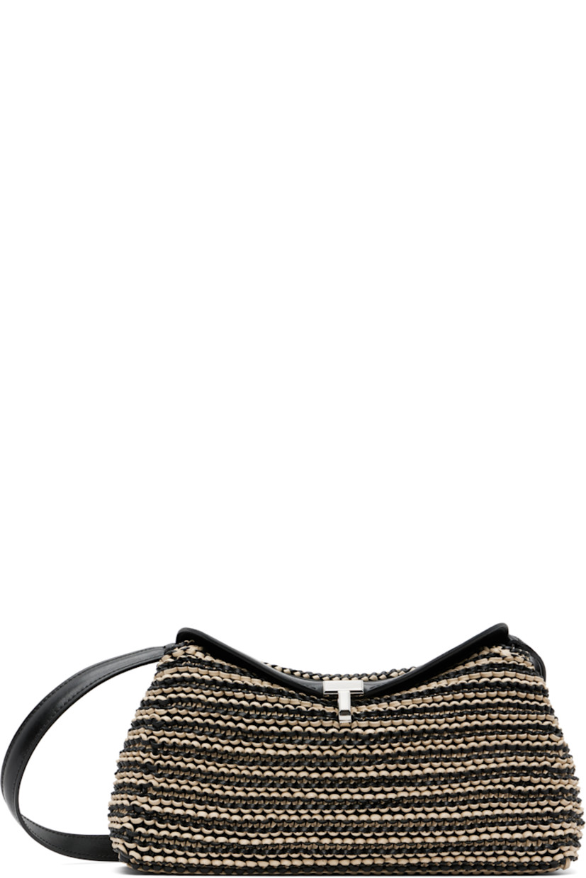 Woven sheepskin clutch.

· Adjustable and detachable shoulder strap
· Turn-lock flap
· Card slot at interior
· Microsuede lining
· Silver-tone hardware 
· H5.5” x W10” x D3.5”

Supplier color: Black/Sand