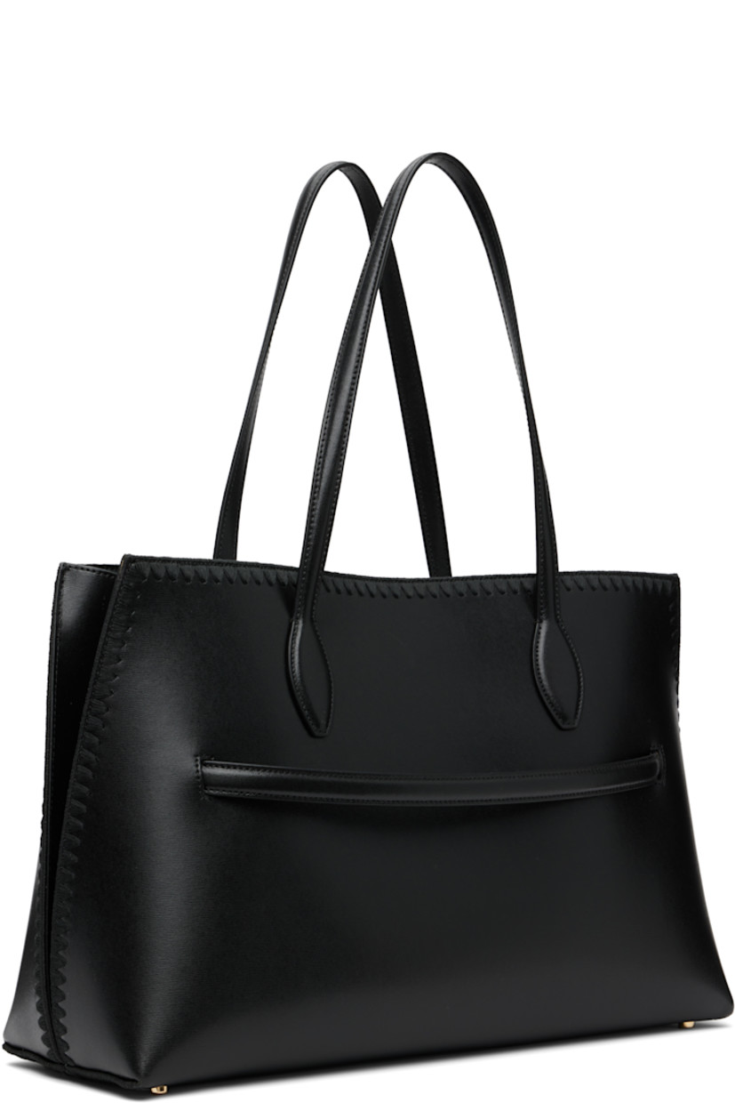 Buffed leather tote.

· Embroidered detailing throughout
· Fixed shoulder straps
· Logo stamped at face
· Removable strap at face
· Lobster clasp closure
· Patch pocket at interior
· Microsuede lining
· Gold-tone hardware
· H11” x W17” x D10”

Supplier color: Black